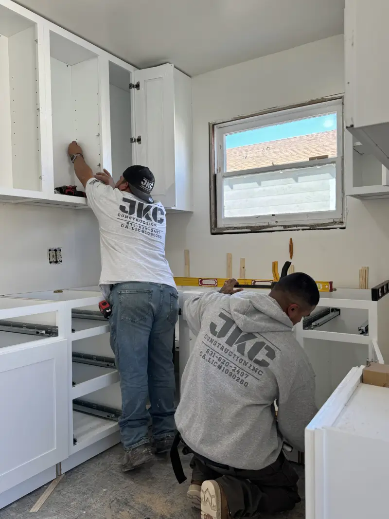 JKC Construction crew installing new kitchen cabinets